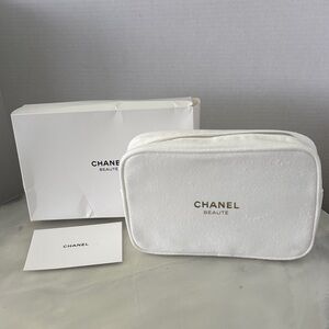 CHANEL White Cosmetic Travel Pouch with Gold Logo
And Chanel Card